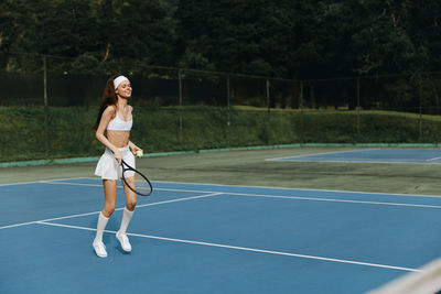 Young woman playing tennis