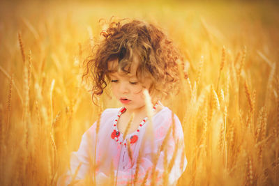 Close-up of girl standing in farm