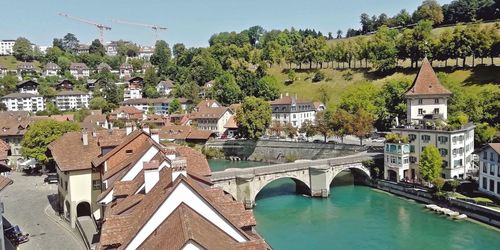 Arch bridge over river in town