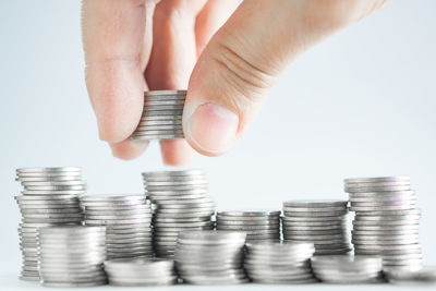 Close-up of hand holding coins