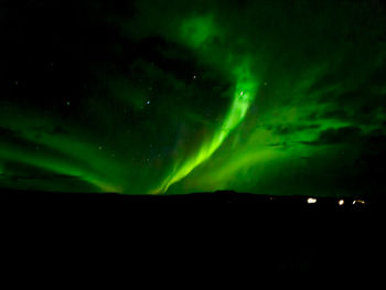 Low angle view of illuminated cityscape at night