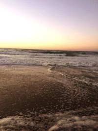 Scenic view of sea against clear sky during sunset