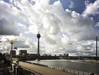 View of bridge over river against cloudy sky