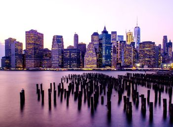 Panoramic view of sea and cityscape against sky