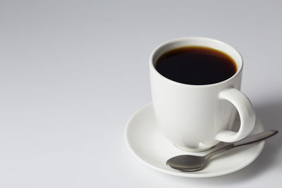 Close-up of coffee cup on table