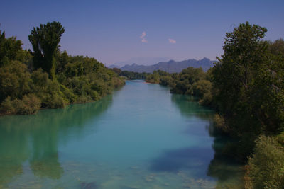 Scenic view of lake against blue sky