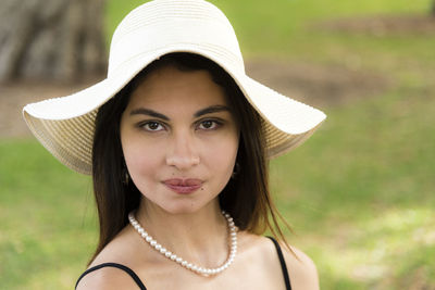 Smiling young woman wearing hat