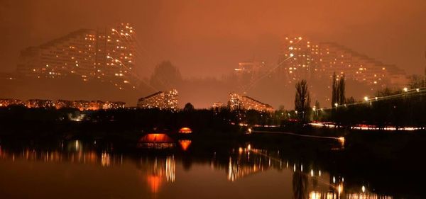 Ferris wheel in city at night