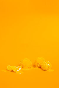 Orange with cream against colored background