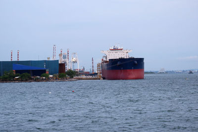 Ship in sea against clear sky