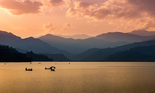 Sea with mountains in background