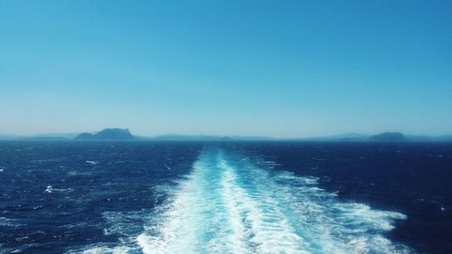 Scenic view of sea against clear blue sky