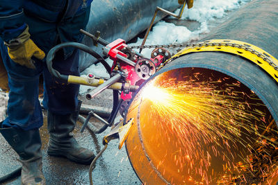 Low section of man working at workshop