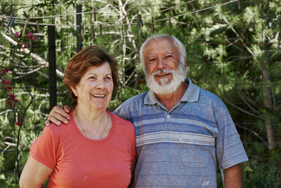 Portrait of smiling man and woman outdoors