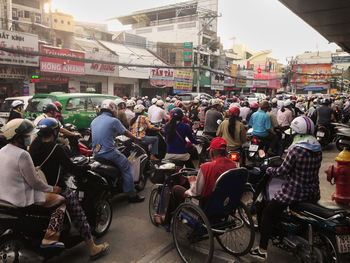 People on bicycles in city