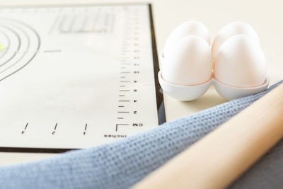 High angle view of pills on book