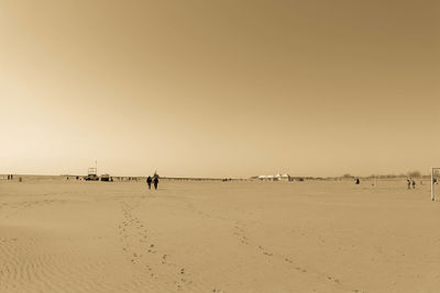 Scenic view of beach against sky during sunset