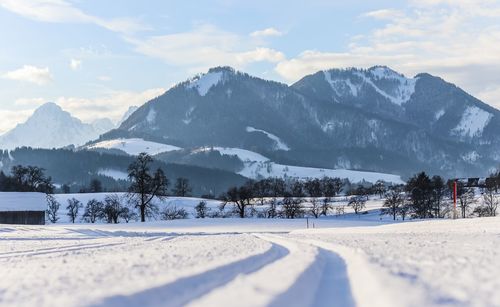 Scenic view of snowcapped mountains against sky