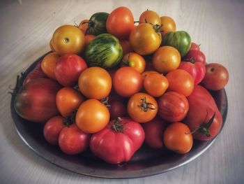 Close-up of tomatoes in plate on table