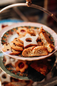 Tasty sweet cookies with almond on a plate. delicious dessert in a cafe