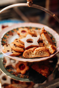 Tasty sweet cookies with almond on a plate. delicious dessert in a cafe
