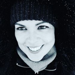 Portrait of smiling woman in snow