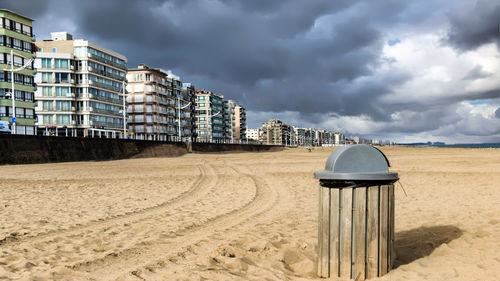 Lifeguard hut on beach against sky