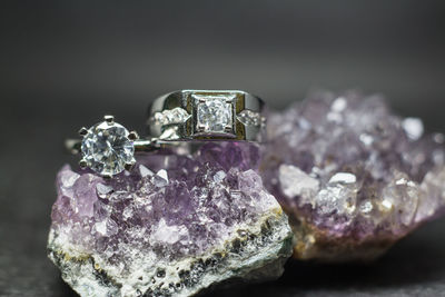 Close-up of wedding rings on rock