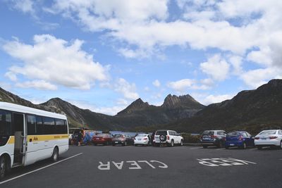 Cars on road against sky