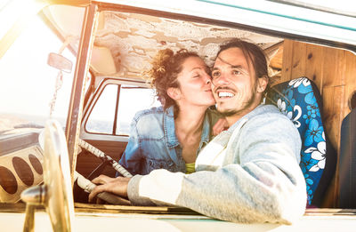 Happy couple in camper van