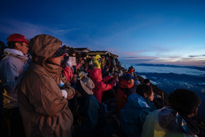 Group of people on snow covered landscape