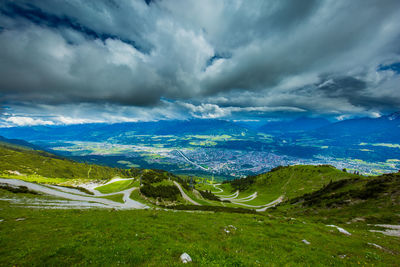 High angle view of countryside landscape against cloudy sky