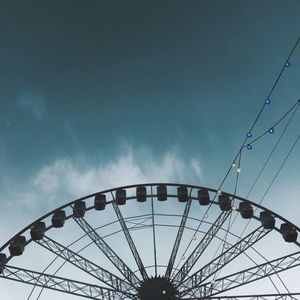 Low angle view of ferris wheel against sky