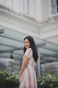 Young woman standing outdoors