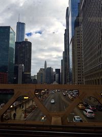 Traffic on road against buildings