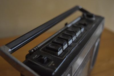 Close-up of vintage radio on table