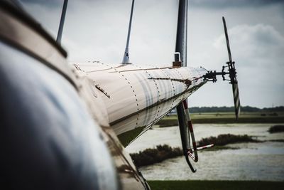 Close-up of ship against sky