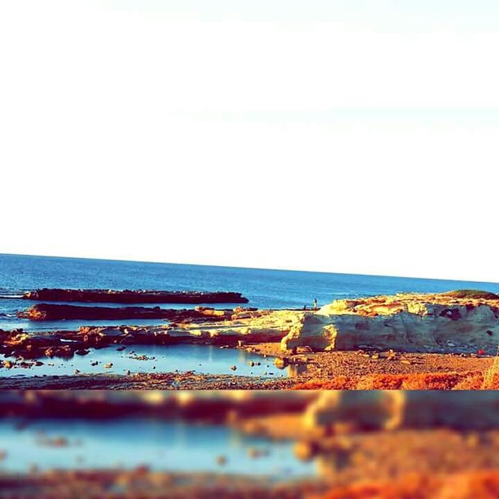 sea, water, clear sky, horizon over water, beach, tranquility, tranquil scene, copy space, nature, scenics, shore, sky, beauty in nature, blue, day, built structure, transportation, outdoors, sand, pier