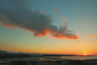 Scenic view of beach against sky during sunset