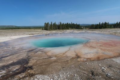 Landscape of blue geyser pool in yellowstone national park