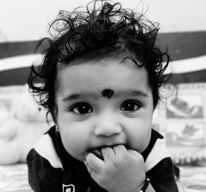 Portrait of cute baby girl at home