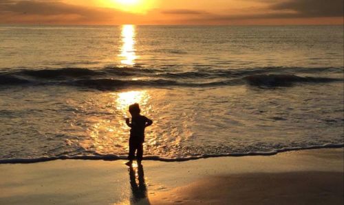 Scenic view of sea at sunset