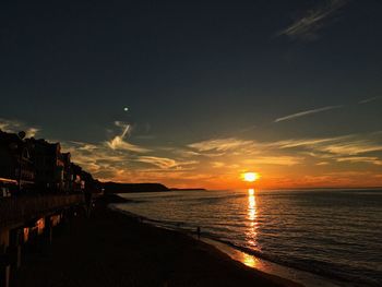 Scenic view of sea against sky at sunset
