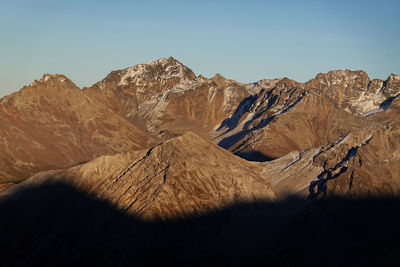 Scenic view of mountain range against clear sky