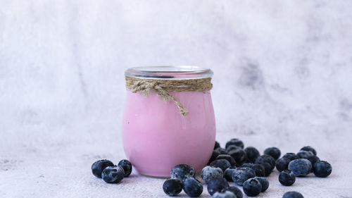 Close-up of fruits in glass jar on table