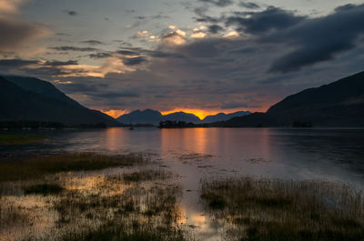 Scenic view of lake against sky during sunset