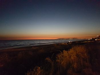 Scenic view of sea at sunset