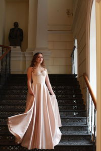 Woman standing on staircase