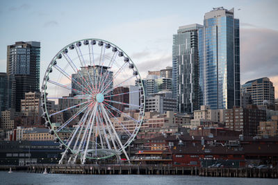 Low angle view of ferris wheel against sky