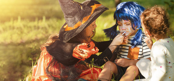 Boy and girls in carnival costumes celebrate halloween